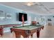 Recreation room with pool table, shuffleboard, and seating at 2323 Waterbluff Pl # V314, Sarasota, FL 34231