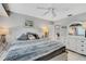 Spacious main bedroom with white dresser and patterned bedding at 2323 Waterbluff Pl # V314, Sarasota, FL 34231