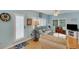 Relaxing living room featuring light blue walls, comfortable seating and a view to the outside at 2323 Waterbluff Pl # V314, Sarasota, FL 34231
