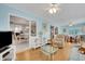 Comfortable living room with ample seating and a view to dining area at 2323 Waterbluff Pl # V314, Sarasota, FL 34231