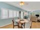 Casual dining area with a round table and light-blue walls at 2323 Waterbluff Pl # V314, Sarasota, FL 34231