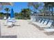 Inviting pool deck with lounge chairs and tables, perfect for relaxation at 2323 Waterbluff Pl # V314, Sarasota, FL 34231