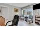 Well-lit office with two armchairs, a desk, and ceiling fan at 2323 Waterbluff Pl # V314, Sarasota, FL 34231