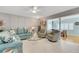 Relaxing living room with teal sofas and a wall of built-ins at 2323 Waterbluff Pl # V314, Sarasota, FL 34231