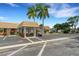 Community building with covered entryway and golf cart at 2323 Waterbluff Pl # V314, Sarasota, FL 34231