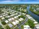Aerial view of a waterfront property with a canal view at 2323 Waterbluff Pl # V314, Sarasota, FL 34231