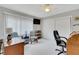 Home office with wood desk, comfortable chairs, and ceiling fan at 2323 Waterbluff Pl # V314, Sarasota, FL 34231