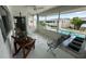 Spacious screened patio with pool and community view at 2501 Beneva Rd # 8, Sarasota, FL 34232