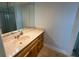 Bathroom with single sink vanity, large mirror and shower at 2501 Beneva Rd # 8, Sarasota, FL 34232