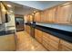 Clean kitchen featuring ample cabinetry and stainless steel appliances at 2501 Beneva Rd # 8, Sarasota, FL 34232