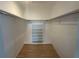 Large walk-in closet with ample shelving and hanging space at 2501 Beneva Rd # 8, Sarasota, FL 34232