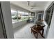 Screened patio with outdoor furniture overlooking a pool at 2501 Beneva Rd # 8, Sarasota, FL 34232