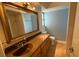 Bathroom with vanity, large mirror, and tiled floor at 2501 Beneva Rd # 8, Sarasota, FL 34232