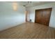 Well-lit bedroom with wood floors and double door closet at 2501 Beneva Rd # 8, Sarasota, FL 34232