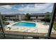 Aerial view of community pool and building at 2501 Beneva Rd # 8, Sarasota, FL 34232