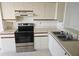 Clean kitchen with stainless steel appliances and double sink at 4410 Fairways Blvd # 602, Bradenton, FL 34209
