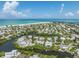 Aerial view of waterfront property with canal at 108 Tern Dr, Anna Maria, FL 34216