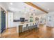 Bright kitchen with breakfast bar seating and hardwood floors at 108 Tern Dr, Anna Maria, FL 34216