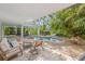 Inviting pool and patio area, ideal for lounging and relaxation at 108 Tern Dr, Anna Maria, FL 34216
