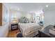 Guest bedroom with a queen bed, nightstand and window seating at 108 Tern Dr, Anna Maria, FL 34216