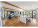 Modern kitchen with a large island, white cabinets and stainless steel appliances at 108 Tern Dr, Anna Maria, FL 34216