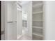 Large walk-in closet with ample shelving and hanging space at 108 Tern Dr, Anna Maria, FL 34216
