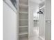 Large walk-in closet with ample shelving and hanging space at 108 Tern Dr, Anna Maria, FL 34216