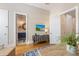 Open living area with built-in cabinetry and access to a powder room at 108 Tern Dr, Anna Maria, FL 34216