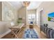 Bright home office features wood desk, wood floors, and large art piece at 108 Tern Dr, Anna Maria, FL 34216
