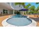 Resort-style pool with a built-in bar and plenty of lounge space at 108 Tern Dr, Anna Maria, FL 34216