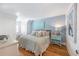 Spacious bedroom with light-blue walls, king-size bed and ample natural light at 108 Tern Dr, Anna Maria, FL 34216