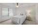 Bright bedroom with a ceiling fan, neutral colors, and a cozy bed by the window at 4714 Elder Berry Dr, Sarasota, FL 34241