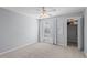Bedroom with a ceiling fan, a window with blinds and an open closet at 4714 Elder Berry Dr, Sarasota, FL 34241