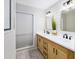 Modern bathroom with double vanity, white subway tile, and stylish light fixtures at 4714 Elder Berry Dr, Sarasota, FL 34241
