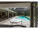 Inviting pool and spa with a screened enclosure and patio at 4714 Elder Berry Dr, Sarasota, FL 34241