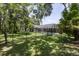 Spacious backyard with fenced pool and lush landscaping at 4714 Elder Berry Dr, Sarasota, FL 34241