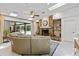 Gathering room with stone fireplace, large sectional sofa, and pool access at 4714 Elder Berry Dr, Sarasota, FL 34241