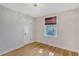 Bright bedroom with hardwood floors and a window with a shade at 1910 Morris St, Sarasota, FL 34239