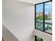 Bright interior hallway with window overlooking street at 1558 4Th St # 210, Sarasota, FL 34236