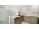 Modern kitchen with wood cabinets, stainless steel appliances, and a quartz island at 1558 4Th St # 210, Sarasota, FL 34236