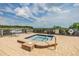 Community hot tub with water views and lounge seating at 111 Tidy Island Blvd # 111, Bradenton, FL 34210