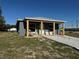 Charming single-story home featuring a modern exterior and a well-lit, covered front porch at 5310 22Nd Street E Ct, Bradenton, FL 34203