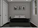 Bedroom with gray bedding and botanical art at 23453 Winthrob Ave, Port Charlotte, FL 33980