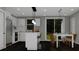 Modern kitchen with white cabinets and island at 23453 Winthrob Ave, Port Charlotte, FL 33980