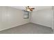 This carpeted bedroom features a ceiling fan and a window at 255 Sherwood Dr # 255U, Bradenton, FL 34210