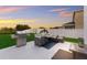 Enjoy sunsets from the backyard patio, complete with grill and seating area at 335 Gris Sky Ln, Bradenton, FL 34212