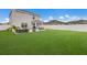 Spacious backyard with patio, hot tub, and green lawn at 335 Gris Sky Ln, Bradenton, FL 34212