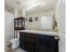 Bathroom boasts double sinks and dark brown cabinets at 335 Gris Sky Ln, Bradenton, FL 34212