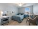 Bedroom with a desk, chair, and a cozy sitting area at 335 Gris Sky Ln, Bradenton, FL 34212