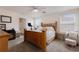 Bright bedroom with a wooden bed frame and ample natural light at 335 Gris Sky Ln, Bradenton, FL 34212